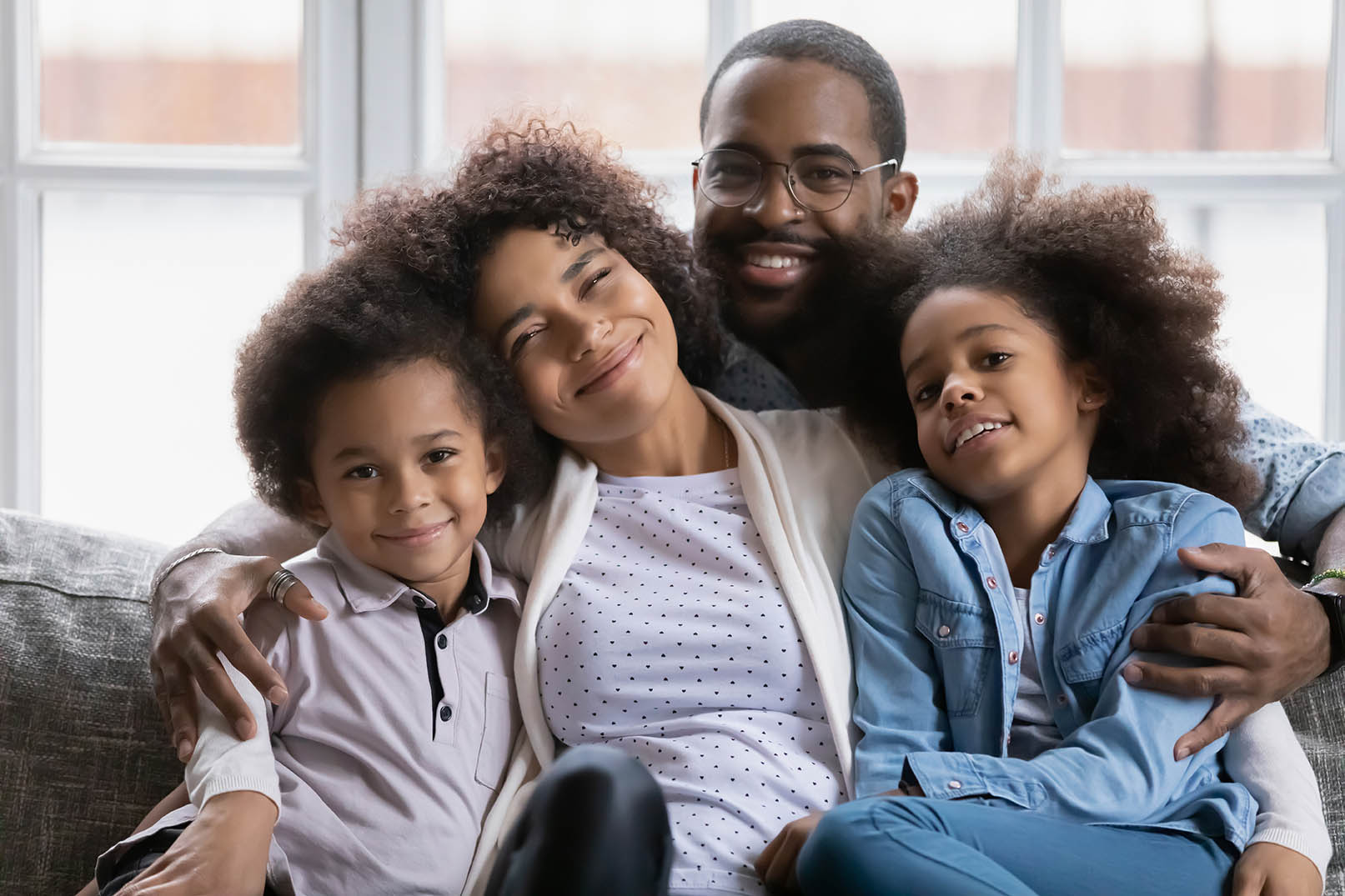 Head shot portrait happy African American family with two kids